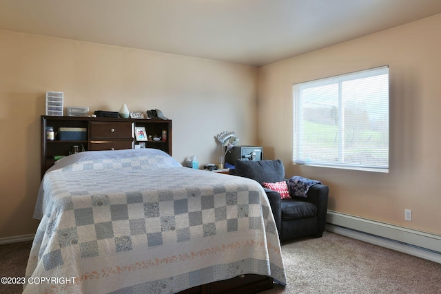 bedroom with a baseboard radiator and carpet flooring