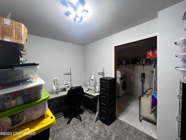 home office with light carpet, a notable chandelier, a textured ceiling, and separate washer and dryer