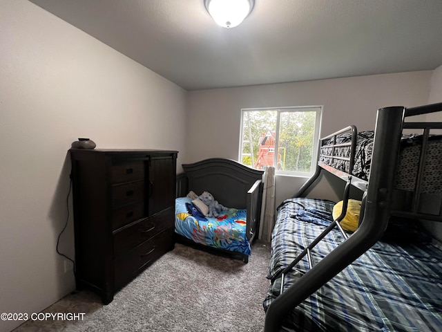 bedroom with dark carpet