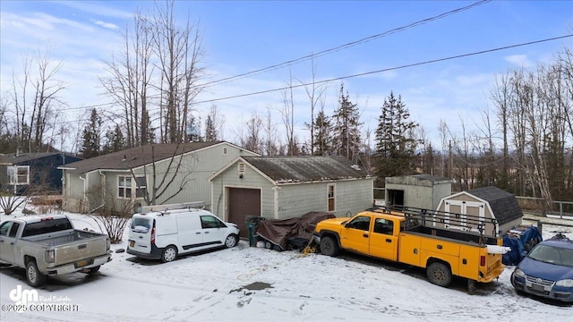 view of front of house with an outbuilding and a storage unit