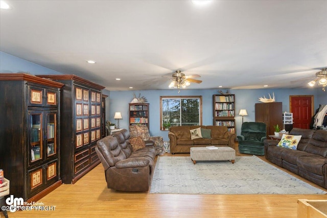 living room with recessed lighting, light wood-type flooring, and ceiling fan