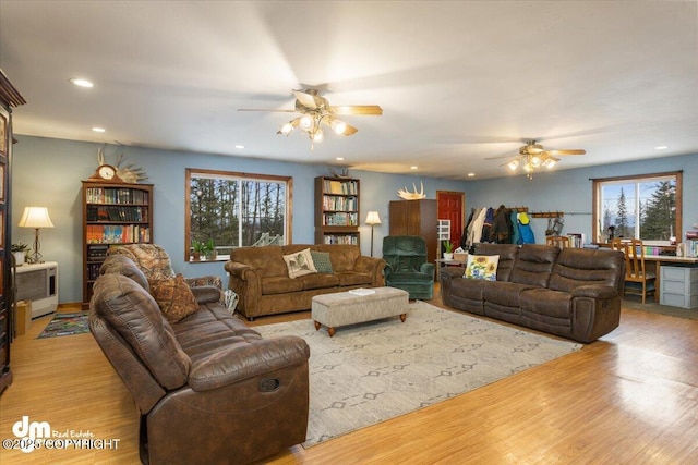 living room with wood finished floors, recessed lighting, and a ceiling fan