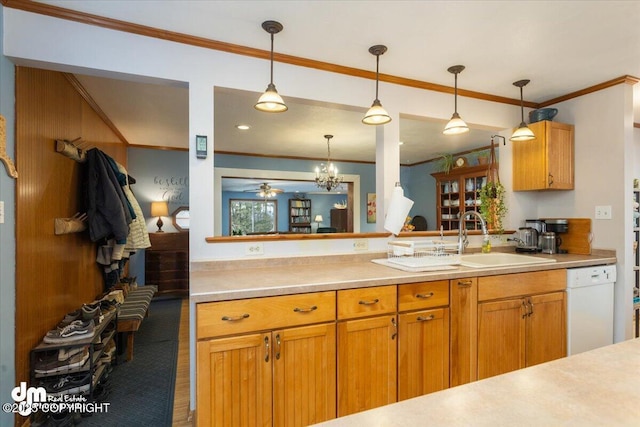 kitchen with dishwasher, light countertops, and decorative light fixtures