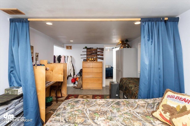 bedroom featuring visible vents and recessed lighting