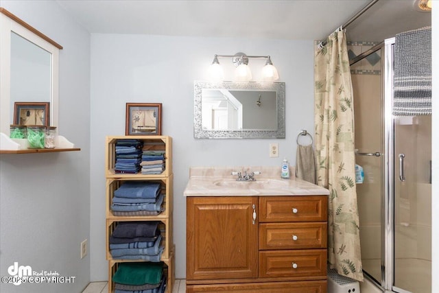 bathroom with vanity and a stall shower