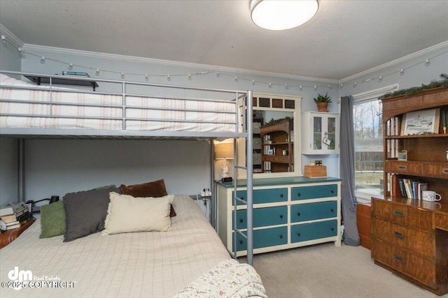 carpeted bedroom featuring ornamental molding