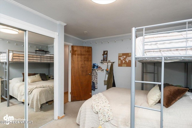 bedroom featuring carpet flooring and crown molding