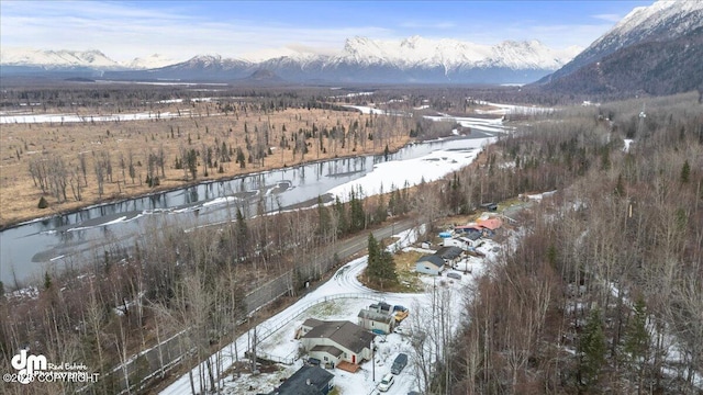 drone / aerial view with a water and mountain view