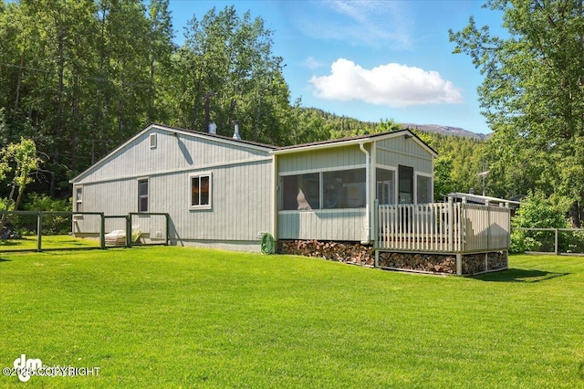 10833 E Twin Peaks Ct, Palmer, AK 99645 - rear view of house with a sunroom and a mountain view