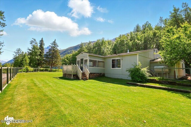 10833 E Twin Peaks Ct, Palmer, AK 99645 - back of property featuring a mountain view, stairway, and a sunroom
