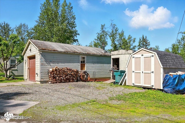 10833 E Twin Peaks Ct, Palmer, AK 99645 - detached garage with a shed