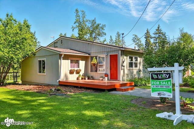 10833 E Twin Peaks Ct, Palmer, AK 99645 - view of front facade featuring a front yard and a wooden deck