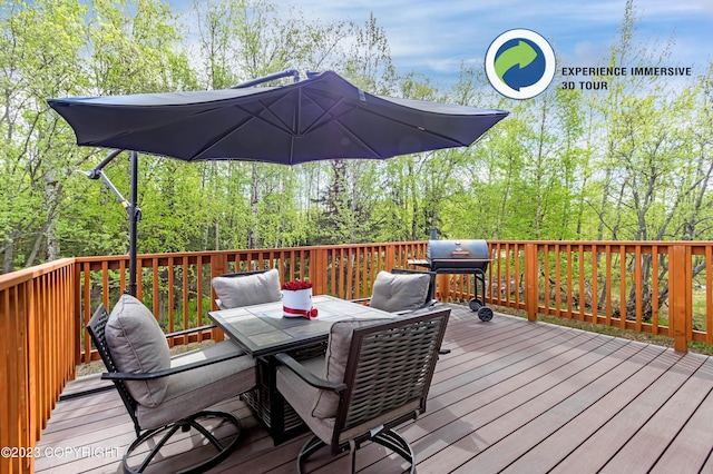 wooden deck featuring grilling area and outdoor dining space