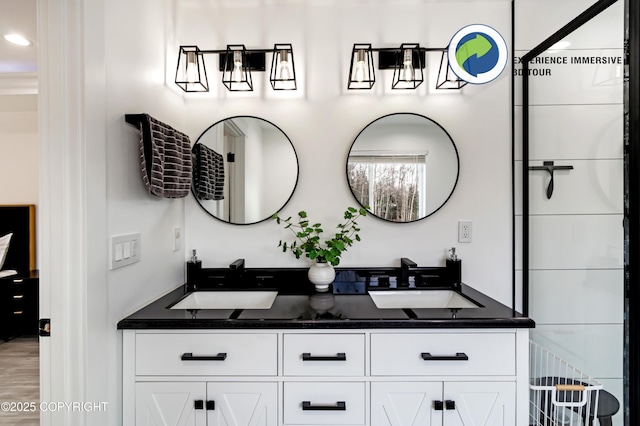 full bath with double vanity and a sink