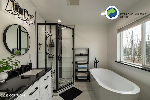 full bath featuring a stall shower, a freestanding tub, visible vents, and vanity