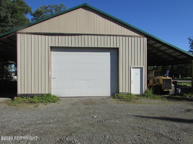 garage featuring a carport