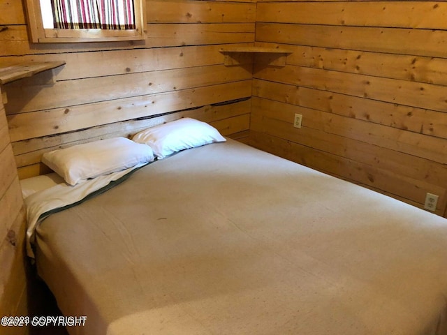 unfurnished bedroom with wooden walls