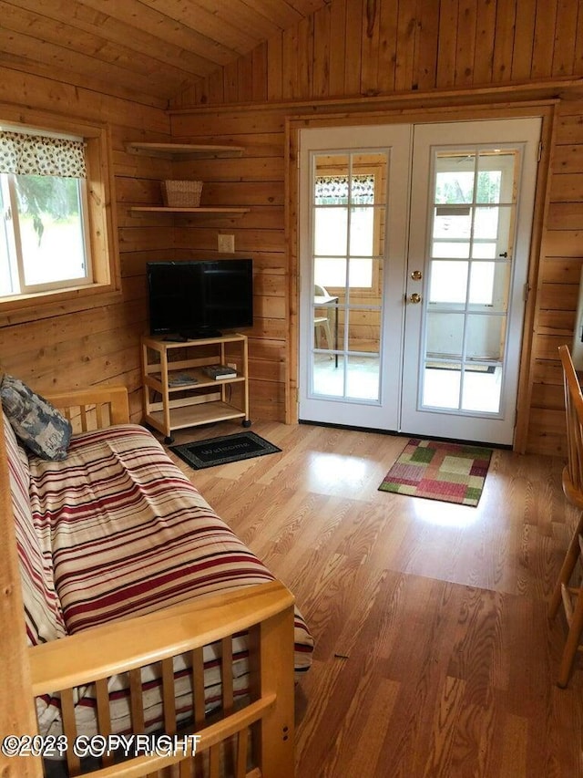 entryway featuring a healthy amount of sunlight, vaulted ceiling, and french doors