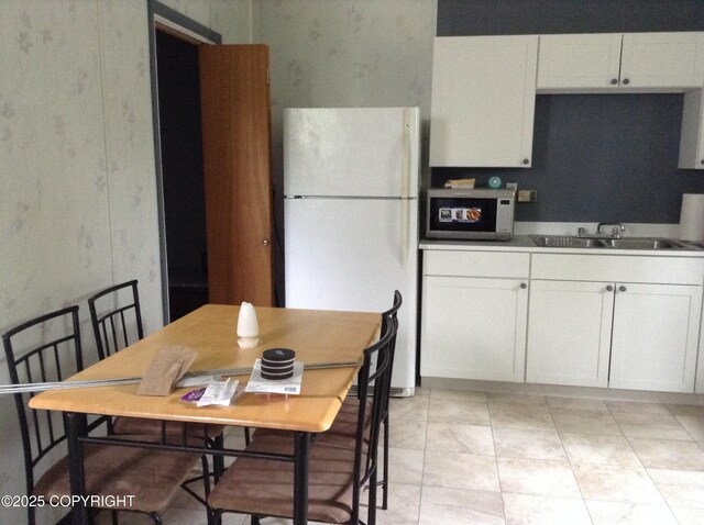 1832 Nerka Loop, Dillingham, AK 99576 - kitchen with white appliances, a sink, and white cabinets