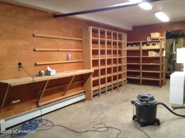 1832 Nerka Loop, Dillingham, AK 99576 - misc room with a baseboard heating unit, concrete floors, and a workshop area