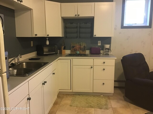 1832 Nerka Loop, Dillingham, AK 99576 - kitchen with a sink, white cabinets, and light countertops