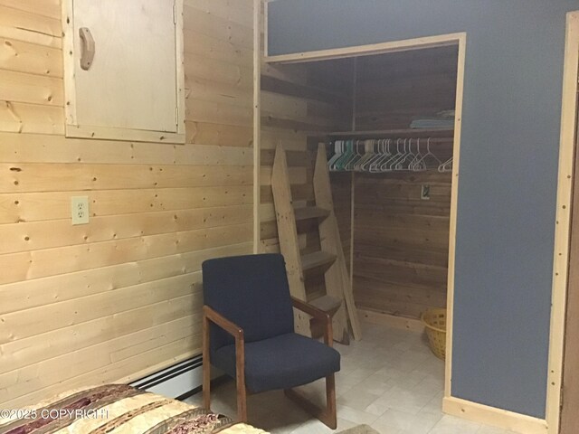 1832 Nerka Loop, Dillingham, AK 99576 - bedroom featuring baseboard heating, wood walls, and light flooring