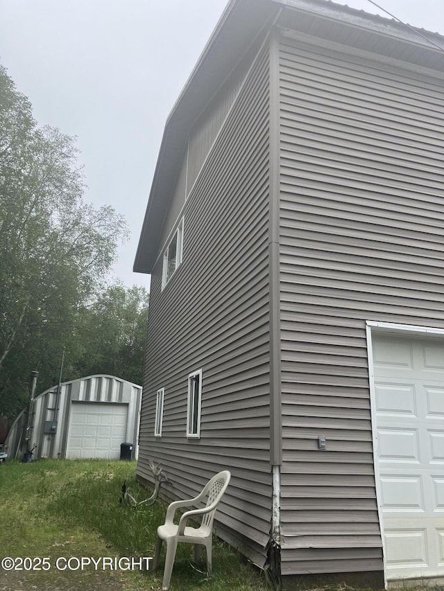 1832 Nerka Loop, Dillingham, AK 99576 - view of home's exterior featuring a garage and an outdoor structure