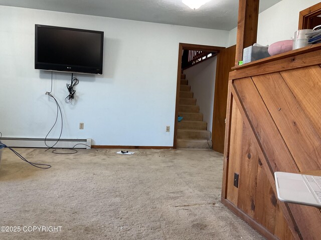 1832 Nerka Loop, Dillingham, AK 99576 - unfurnished living room with a baseboard radiator, carpet, stairs, and baseboards