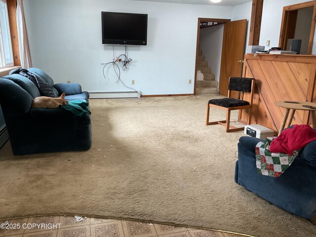 1832 Nerka Loop, Dillingham, AK 99576 - living area featuring baseboard heating, carpet, and stairway
