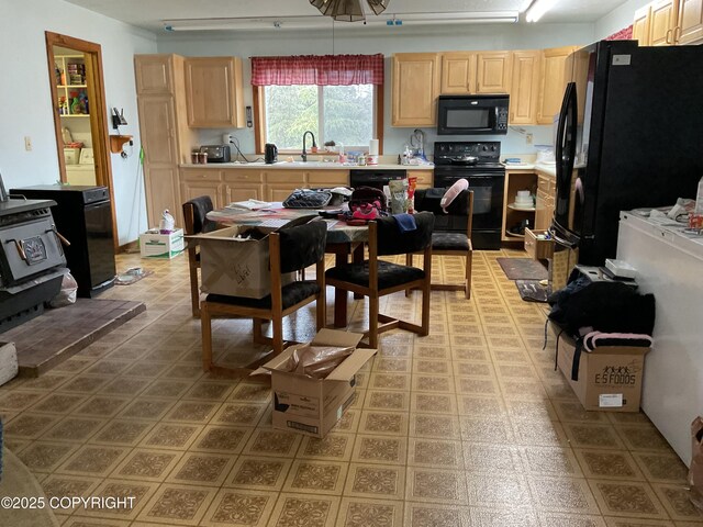 1832 Nerka Loop, Dillingham, AK 99576 - kitchen with black appliances, light brown cabinets, a sink, and light countertops