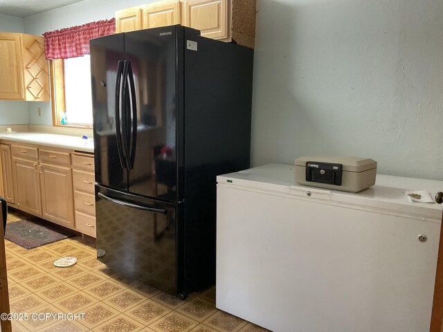 1832 Nerka Loop, Dillingham, AK 99576 - kitchen featuring freestanding refrigerator, light brown cabinets, and light countertops
