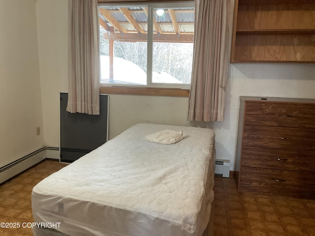 1832 Nerka Loop, Dillingham, AK 99576 - bedroom with dark floors and baseboard heating