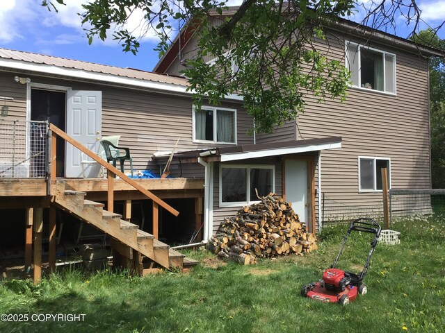 1832 Nerka Loop, Dillingham, AK 99576 - rear view of house featuring stairs, metal roof, a deck, and a lawn