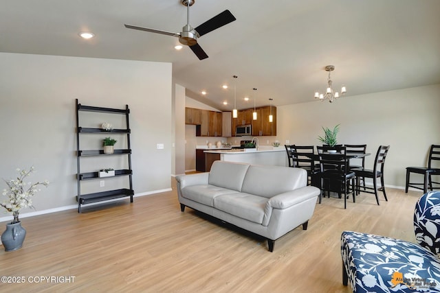 5991 Takotna Loop, Anchorage, AK 99504 - living room with light wood-style floors, a chandelier, vaulted ceiling, recessed lighting, and ceiling fan