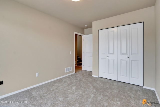5991 Takotna Loop, Anchorage, AK 99504 - unfurnished bedroom with carpet and a closet