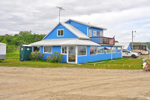 view of front facade with a storage shed