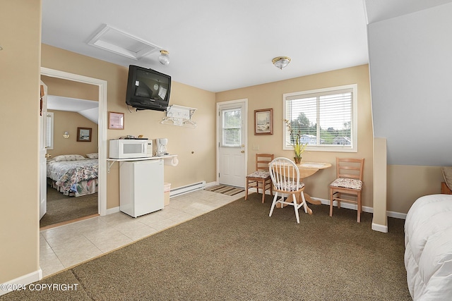 15264 Airport Ln, Ninilchik, AK 99639 - dining area with light colored carpet, baseboard heating, and light tile patterned floors