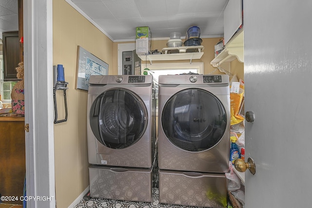 15264 Airport Ln, Ninilchik, AK 99639 - clothes washing area with crown molding, washer and dryer, and laundry area