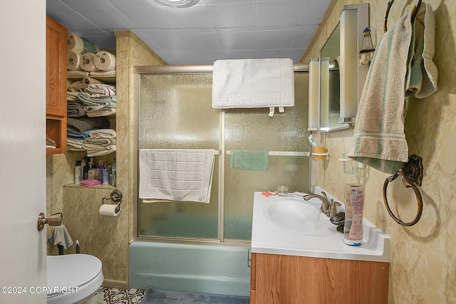 15264 Airport Ln, Ninilchik, AK 99639 - bathroom featuring combined bath / shower with glass door, toilet, and vanity