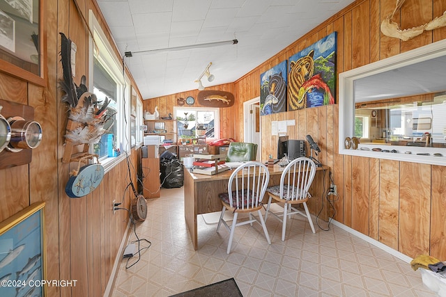 15264 Airport Ln, Ninilchik, AK 99639 - dining space with wood walls, lofted ceiling, and light floors
