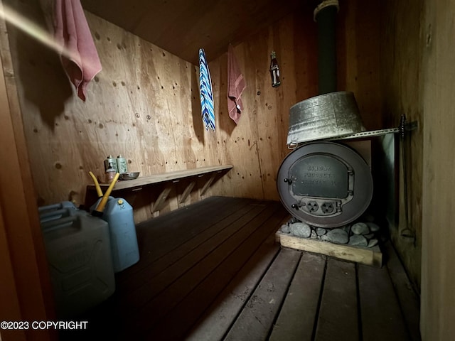 view of sauna with wood-type flooring and wood walls