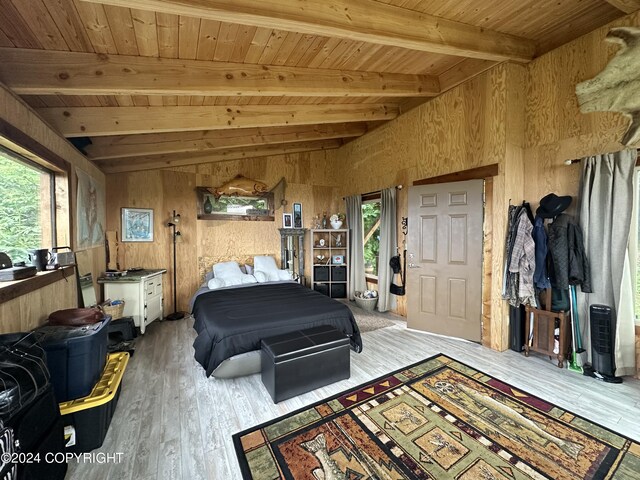 interior space featuring wood walls, wood-type flooring, wooden ceiling, and vaulted ceiling with beams