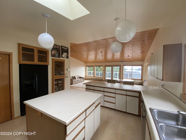 kitchen with pendant lighting, sink, wood ceiling, black fridge with ice dispenser, and white cabinets