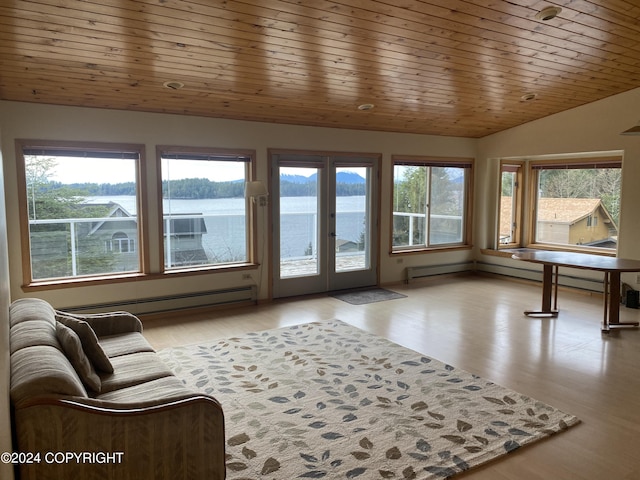 sunroom / solarium featuring a water view, a healthy amount of sunlight, and wood ceiling