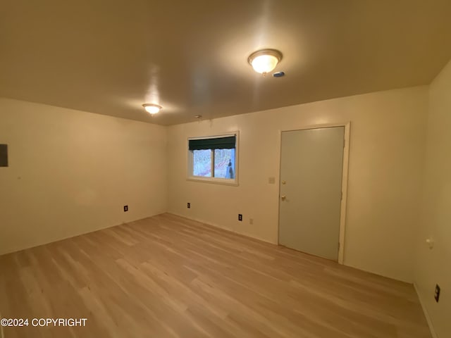 spare room featuring light hardwood / wood-style flooring