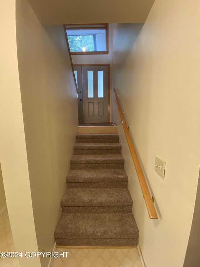 stairs with a towering ceiling