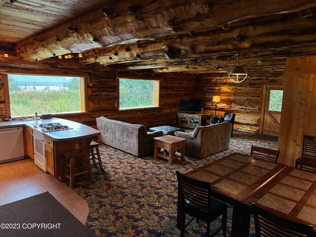 344 Eagle Bluff Dr, Haines, AK 99827 - living area with log walls, a healthy amount of sunlight, light wood-style floors, and wood ceiling