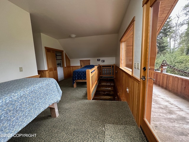 344 Eagle Bluff Dr, Haines, AK 99827 - carpeted bedroom with a wainscoted wall, wood walls, and vaulted ceiling