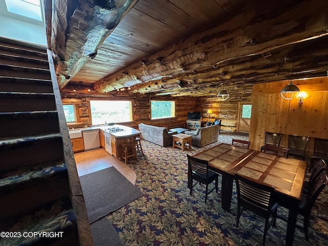 344 Eagle Bluff Dr, Haines, AK 99827 - dining space with stairs, beam ceiling, wood ceiling, and log walls