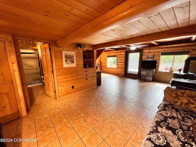 unfurnished living room featuring light tile patterned flooring, rustic walls, wood ceiling, wooden walls, and beam ceiling